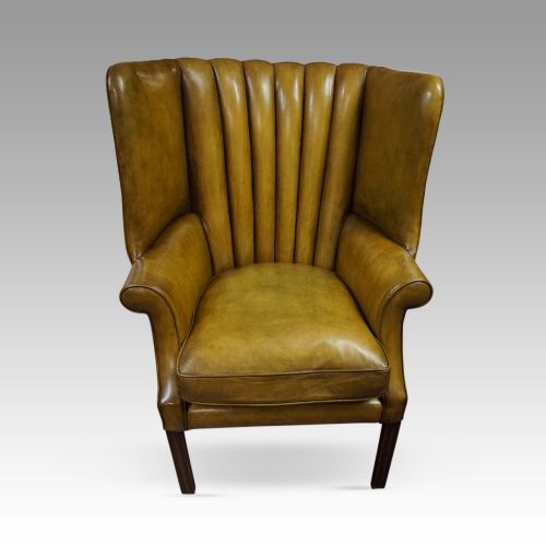 fig 6. Antique leather wing chair