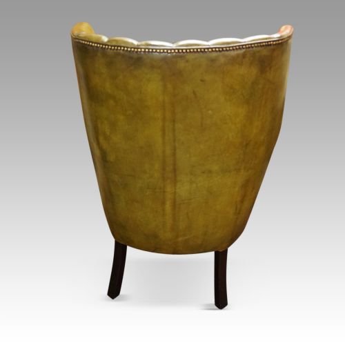 fig 7. Antique leather wing chair