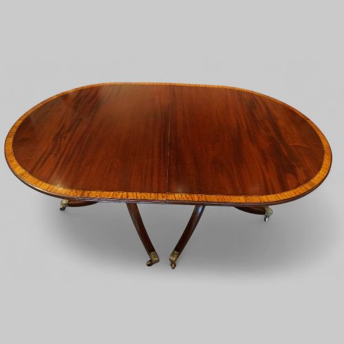 fig 10. George V mahogany twin pillar dining table