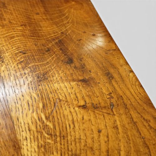 fig 3. A rectangular solid oak refectory dining table featuring turned bulbous pedestal supports connected by a low central stretcher rail.