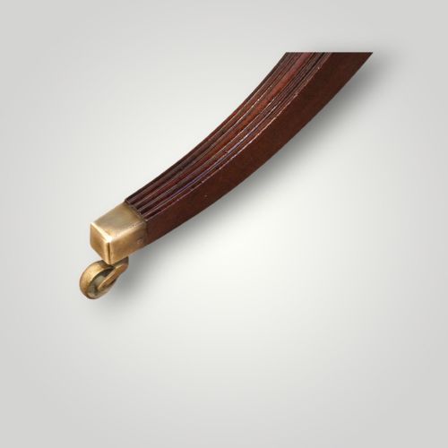 fig 3. A polished mahogany twin pillar dining table featuring rounded corners, two turned central pedestals, and splayed legs resting on brass castors.