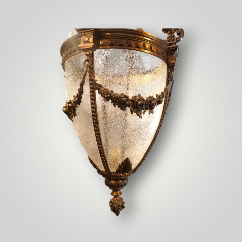 fig 6. A nineteenth-century gilt bronze hall lantern featuring a tapered glass vessel, acanthus leaf canopy, and decorative drapery swags.
