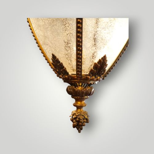 fig 8. A nineteenth-century gilt bronze hall lantern featuring a tapered glass vessel, acanthus leaf canopy, and decorative drapery swags.