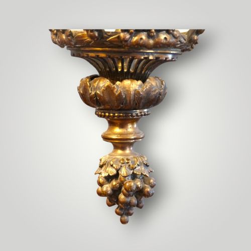 fig 9. A nineteenth-century gilt bronze hall lantern featuring a tapered glass vessel, acanthus leaf canopy, and decorative drapery swags.