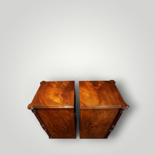 fig 8. A matching pair of narrow Victorian mahogany bedside chests featuring five graduated drawers with turned side columns on plinth bases.