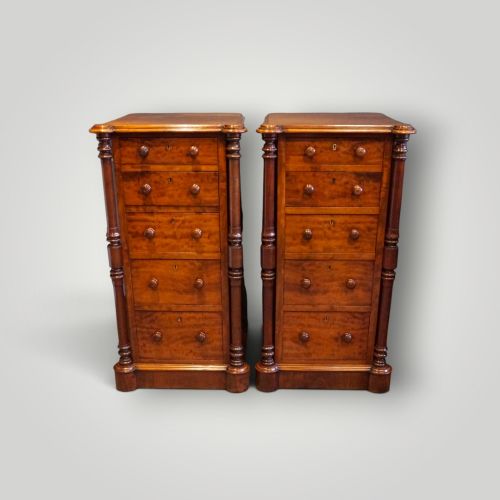 fig 10. A matching pair of narrow Victorian mahogany bedside chests featuring five graduated drawers with turned side columns on plinth bases.