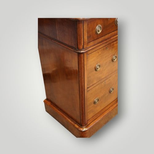 fig 3. A pair of matching Victorian mahogany bedside chests, each featuring three drawers with brass ring handles and a solid plinth base.
