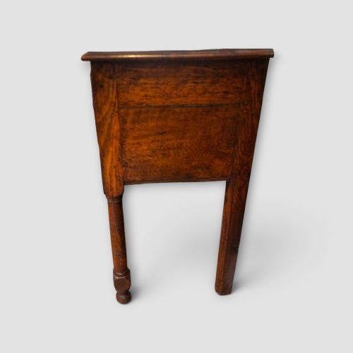 fig 8. An 18th-century George III dark oak dresser base featuring three drawers with brass handles and a scalloped apron on turned legs.