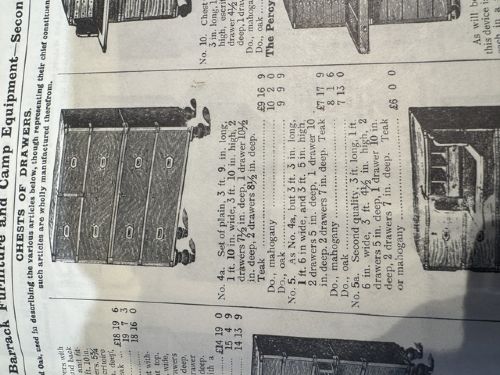 fig 1. A Victorian teak two-part military campaign chest of drawers featuring flush brass handles, brass corner mounts, and turned feet.