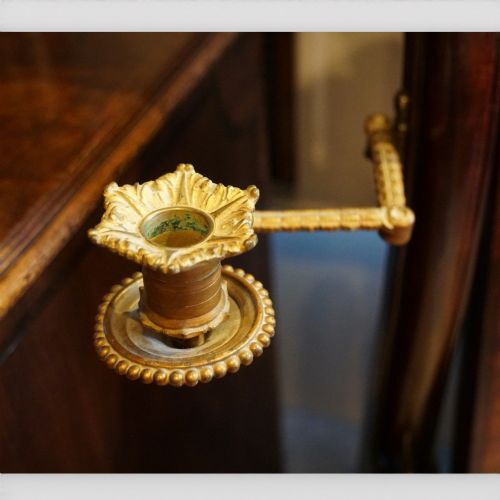 fig 4. A Victorian mahogany cheval mirror with a rectangular rounded tilting glass frame, dual upright supports, and a curved plinth base set on scroll legs.