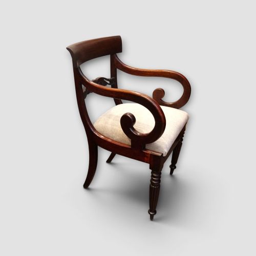 fig 2. A set of eight William IV dark mahogany dining chairs comprising six side chairs and two carvers with turned front legs and light neutral upholstered seats.