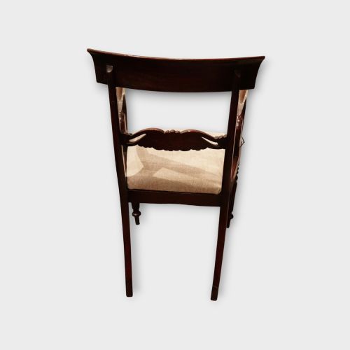 fig 5. A set of eight William IV dark mahogany dining chairs comprising six side chairs and two carvers with turned front legs and light neutral upholstered seats.