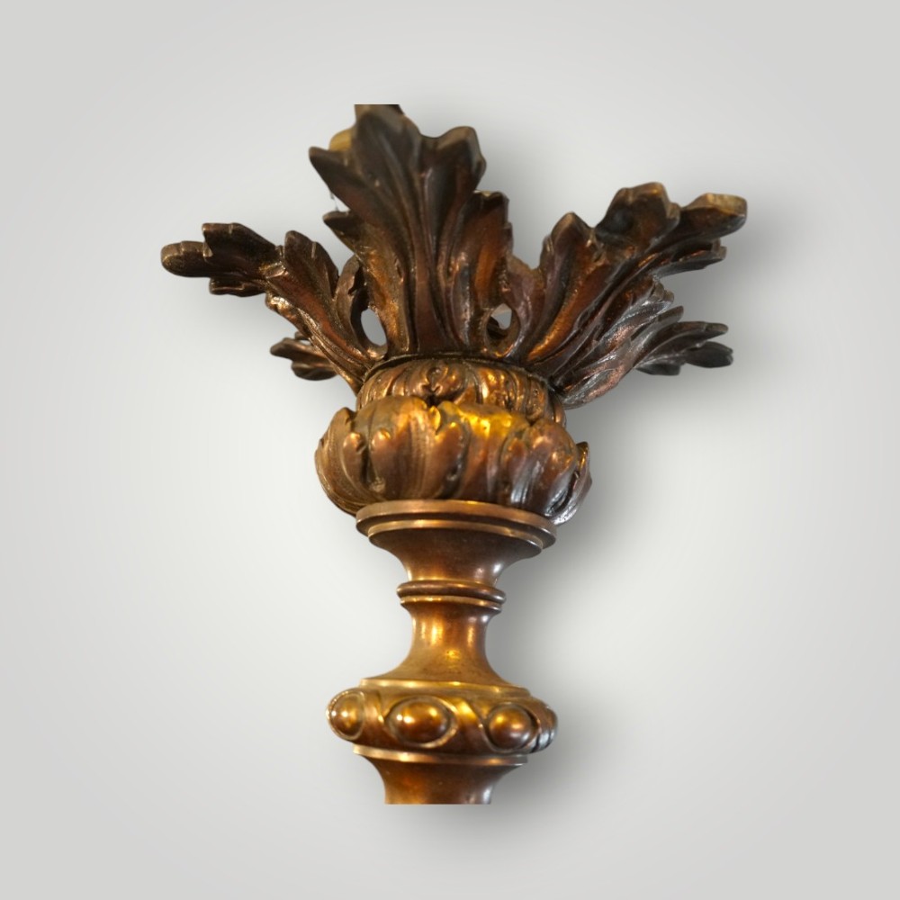 A nineteenth-century gilt bronze hall lantern featuring a tapered glass vessel, acanthus leaf canopy, and decorative drapery swags. View V