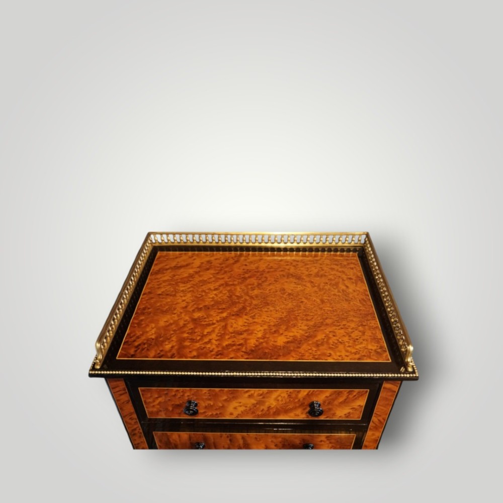 A Victorian ebonised and thuya wood pedestal desk featuring a leather writing surface, raised side drawers, ivory inlay, and ceramic plaque details. View IV