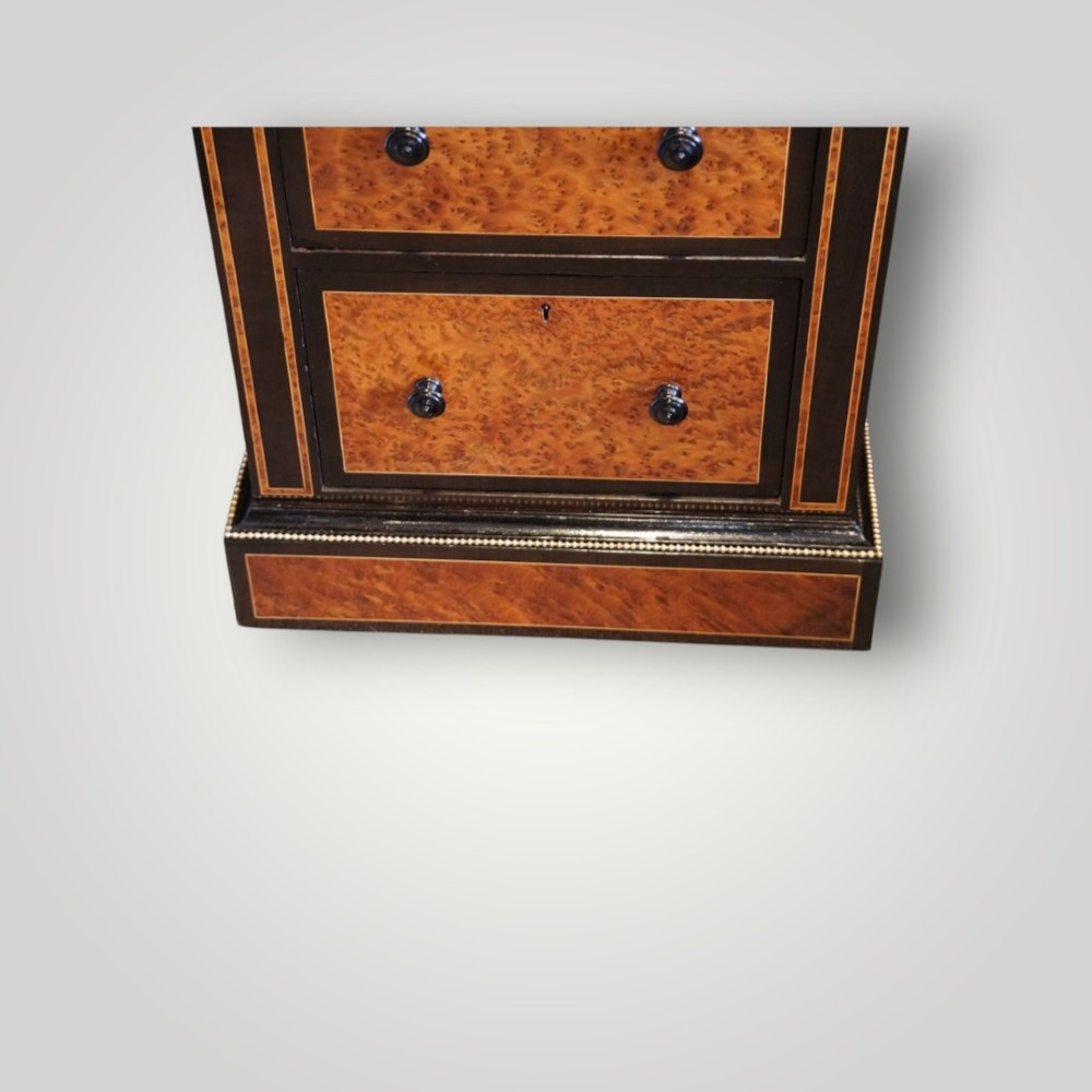 A Victorian ebonised and thuya wood pedestal desk featuring a leather writing surface, raised side drawers, ivory inlay, and ceramic plaque details. View XII