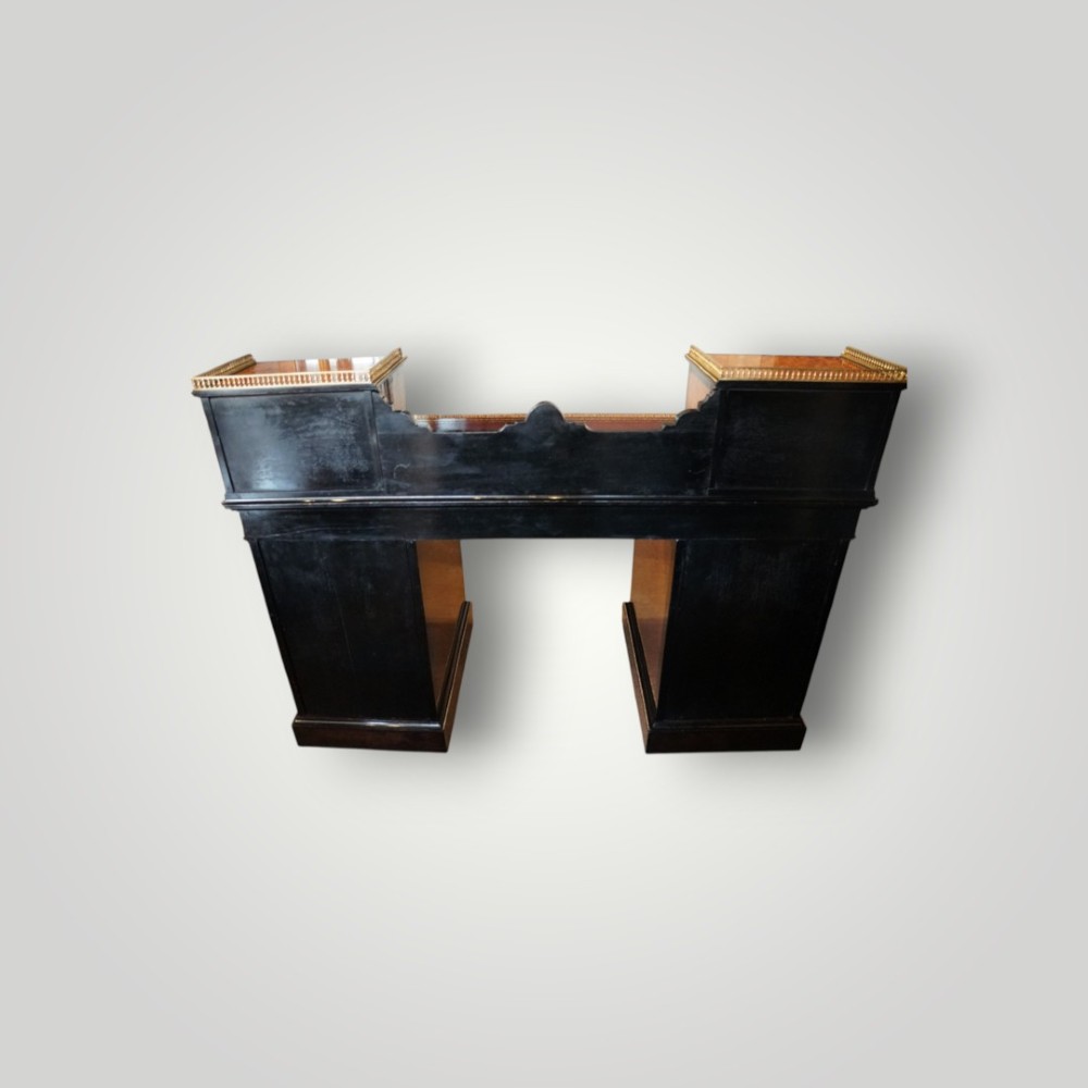A Victorian ebonised and thuya wood pedestal desk featuring a leather writing surface, raised side drawers, ivory inlay, and ceramic plaque details. View XIII