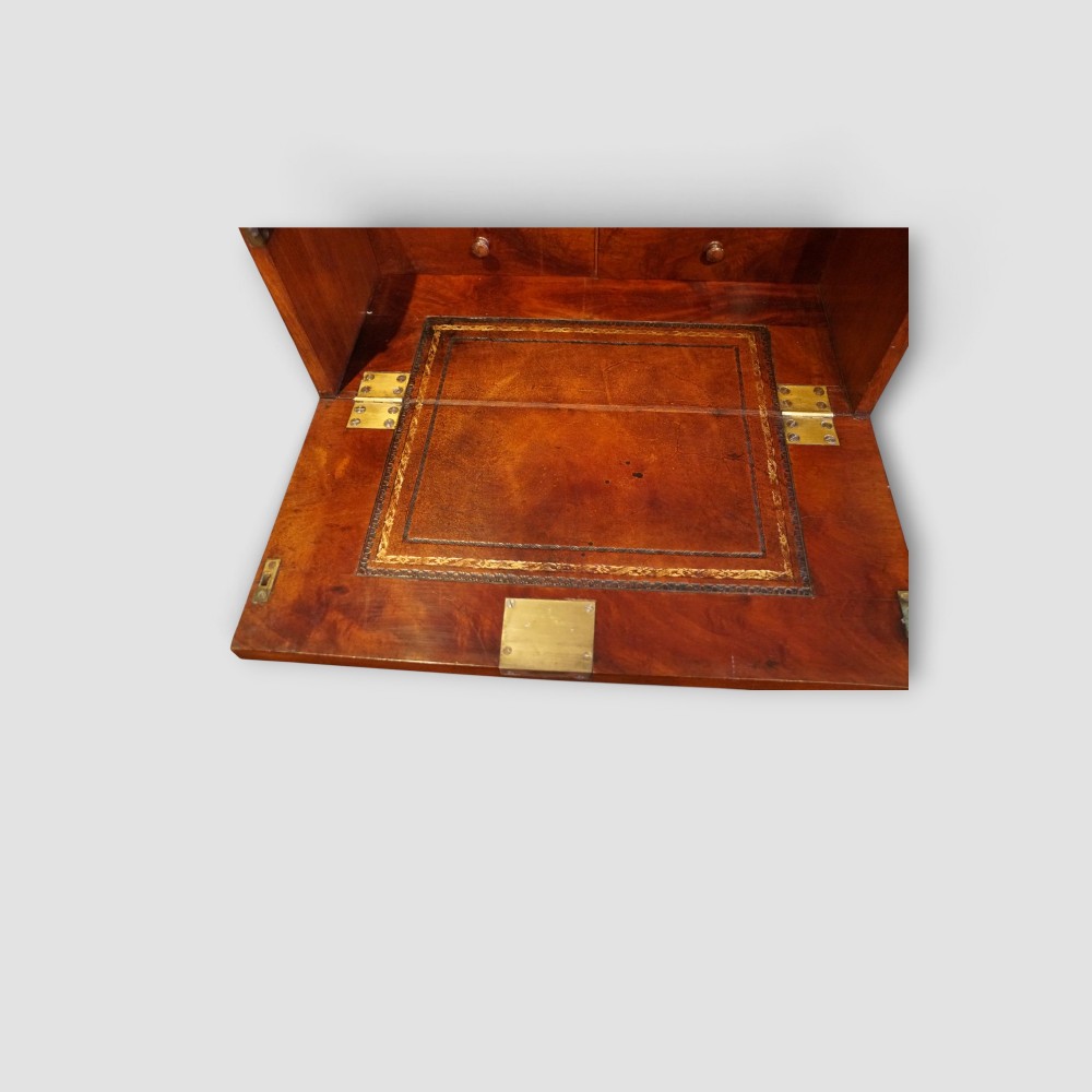 A tall Victorian mahogany Wellington chest featuring seven drawer fronts, turned wooden knobs, and a right-hand side locking flap. View VIII