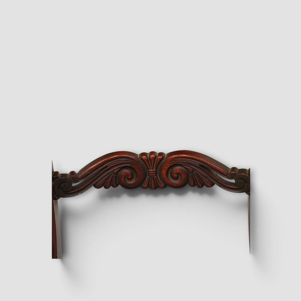 A set of eight William IV dark mahogany dining chairs comprising six side chairs and two carvers with turned front legs and light neutral upholstered seats. View VIII