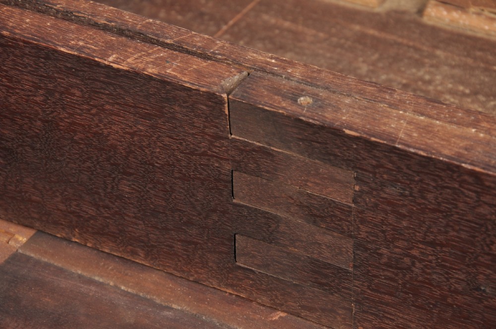 An 18th-century mahogany gateleg table featuring a drop-leaf top, hinged rounded leaves, and slender cabriole legs terminating in pad feet. View VI