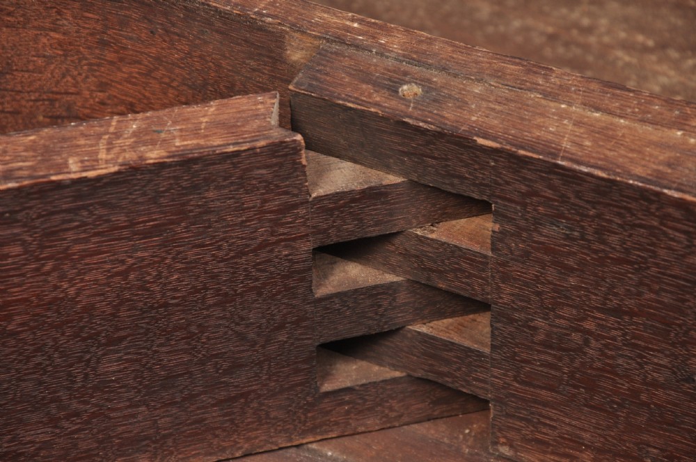 An 18th-century mahogany gateleg table featuring a drop-leaf top, hinged rounded leaves, and slender cabriole legs terminating in pad feet. View VII