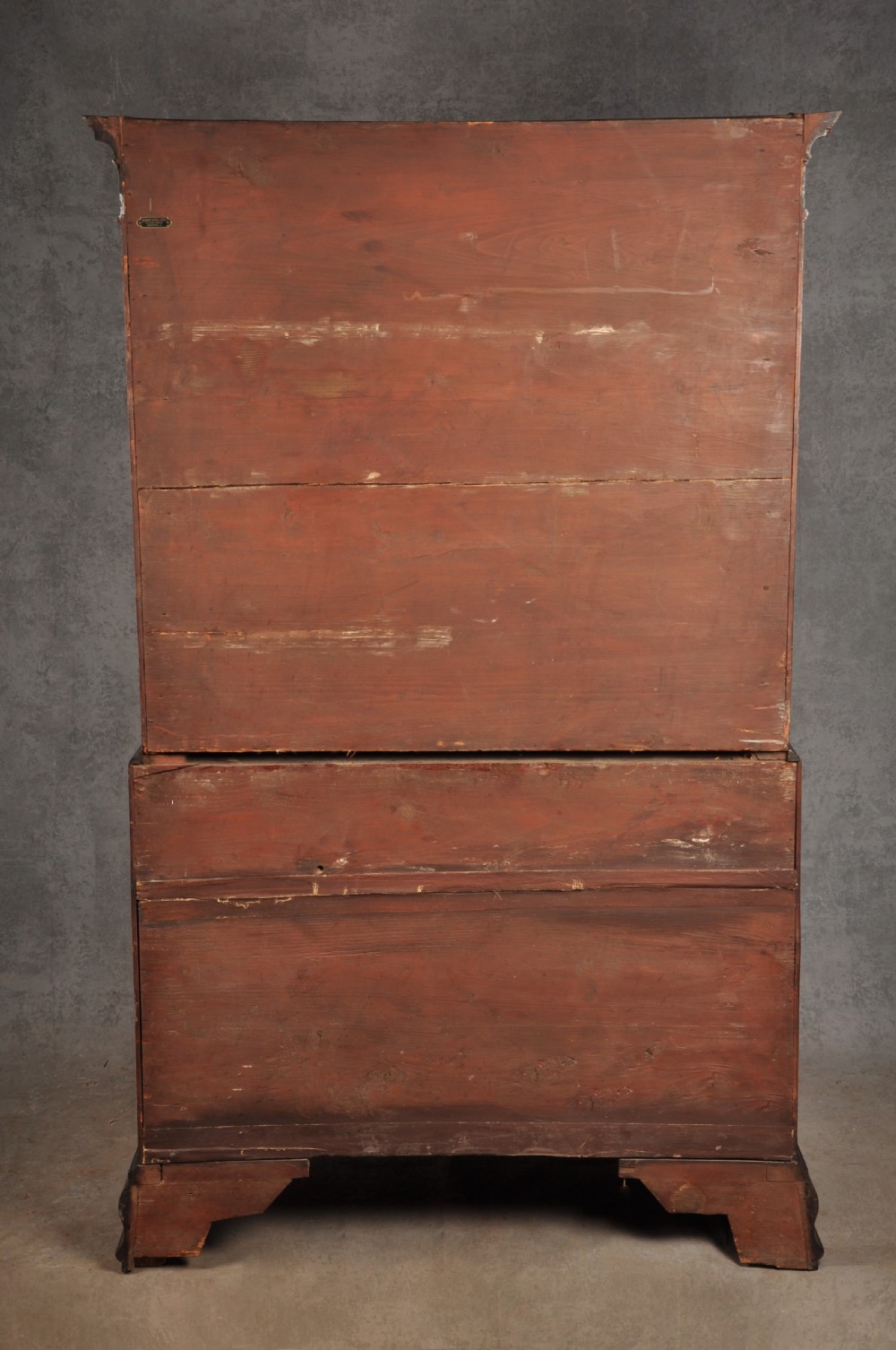 An 18th-century Georgian flame mahogany tallboy featuring a carved fretwork cornice, brass swan-neck handles, and ogee bracket feet. View XXV