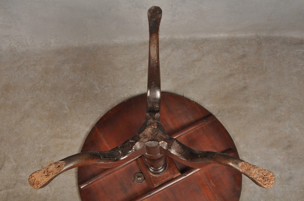 An 18th-century cherrywood tripod table featuring a circular top, turned baluster pedestal, and three splayed cabriole legs. View IX