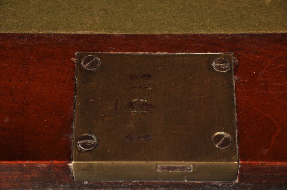 An 18th-century mahogany secretaire cabinet featuring twin upper doors with shaped gilded mouldings above an open fall-front desk with pigeonholes and three drawers on bracket feet. View VII