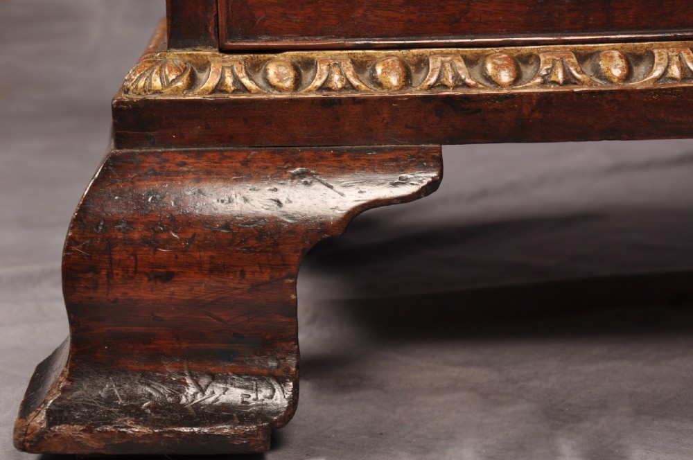 An 18th-century mahogany secretaire cabinet featuring twin upper doors with shaped gilded mouldings above an open fall-front desk with pigeonholes and three drawers on bracket feet. View XII