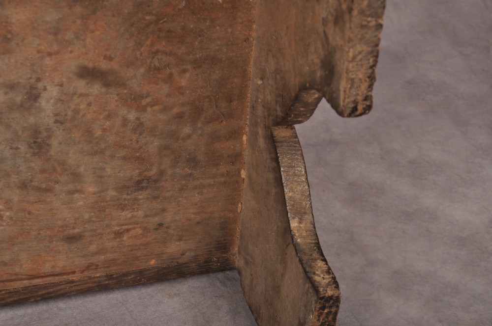 A Tudor era dark oak coffer featuring four carved linenfold panels and an iron lockplate on the front facade. View XIV