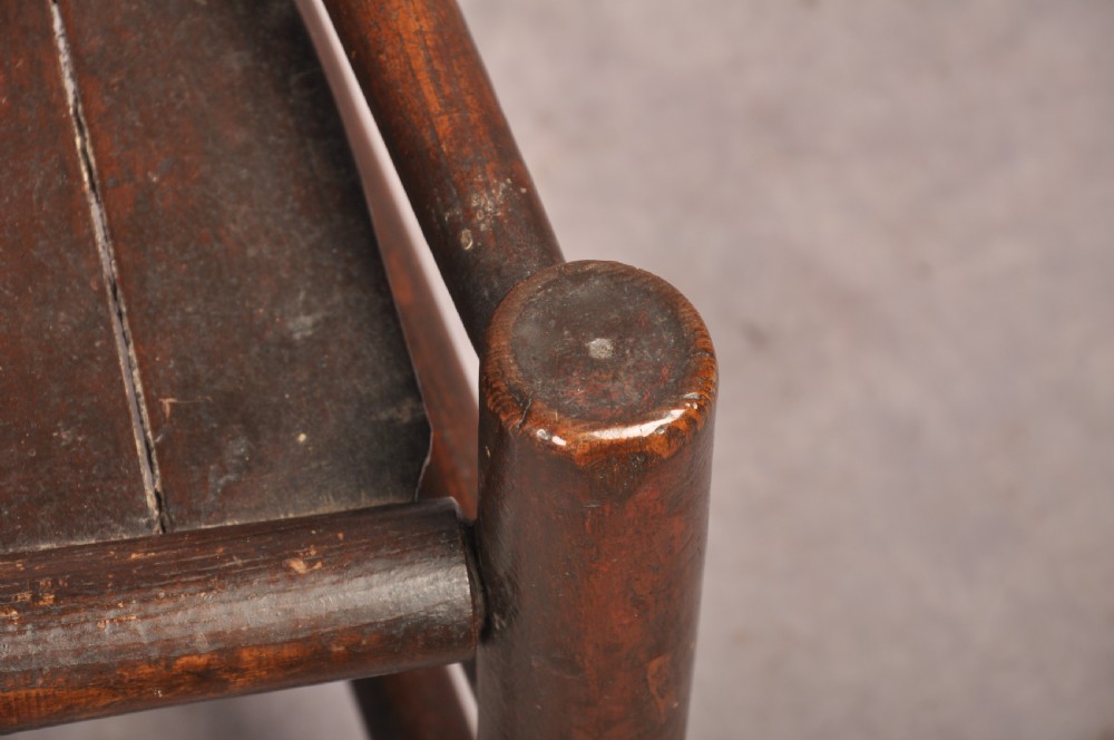 A near pair of dark 17th-century turned ash chairs with spindle backrests, turned stretchers, panel seats, and top finials. View XIII
