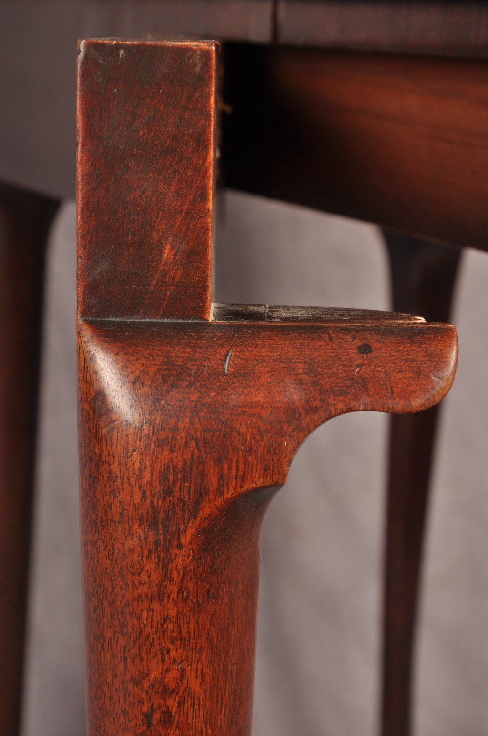An 18th-century mahogany triple-top card table resting on four cabriole legs with pad feet. View XIV