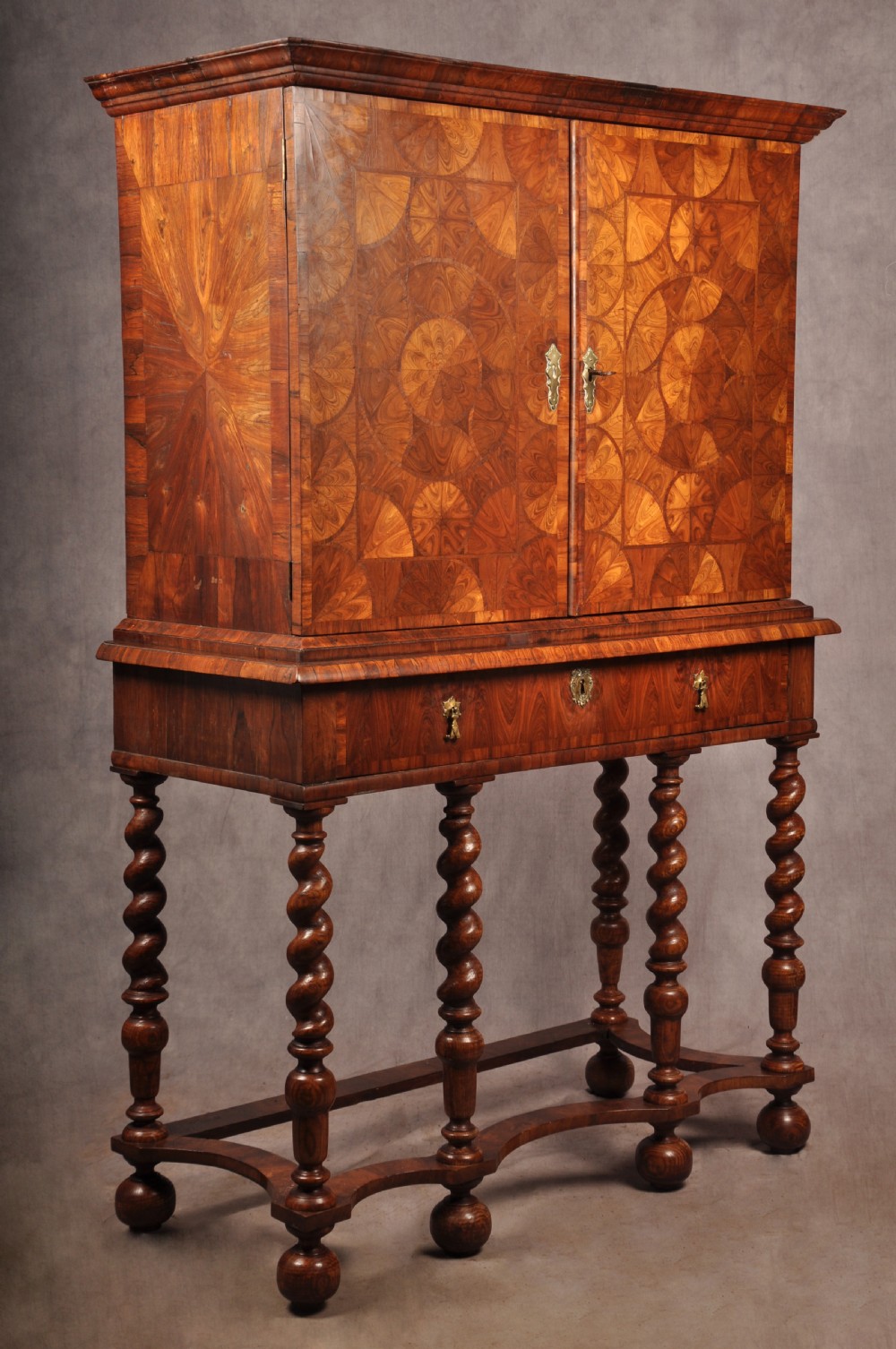 A seventeenth-century kingwood cabinet on stand featuring geometric oyster parquetry doors, a single frieze drawer, six barley twist legs, and a shaped stretcher. View III