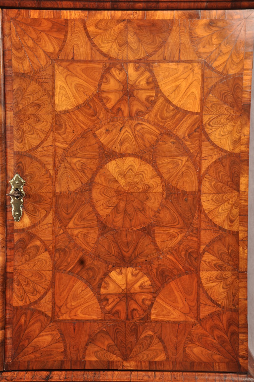 A seventeenth-century kingwood cabinet on stand featuring geometric oyster parquetry doors, a single frieze drawer, six barley twist legs, and a shaped stretcher. View IV