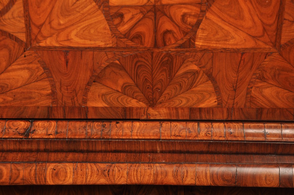 A seventeenth-century kingwood cabinet on stand featuring geometric oyster parquetry doors, a single frieze drawer, six barley twist legs, and a shaped stretcher. View VI