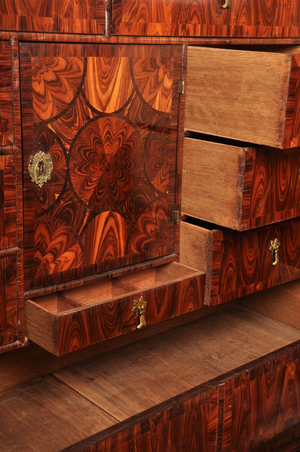 A seventeenth-century kingwood cabinet on stand featuring geometric oyster parquetry doors, a single frieze drawer, six barley twist legs, and a shaped stretcher. View XIII