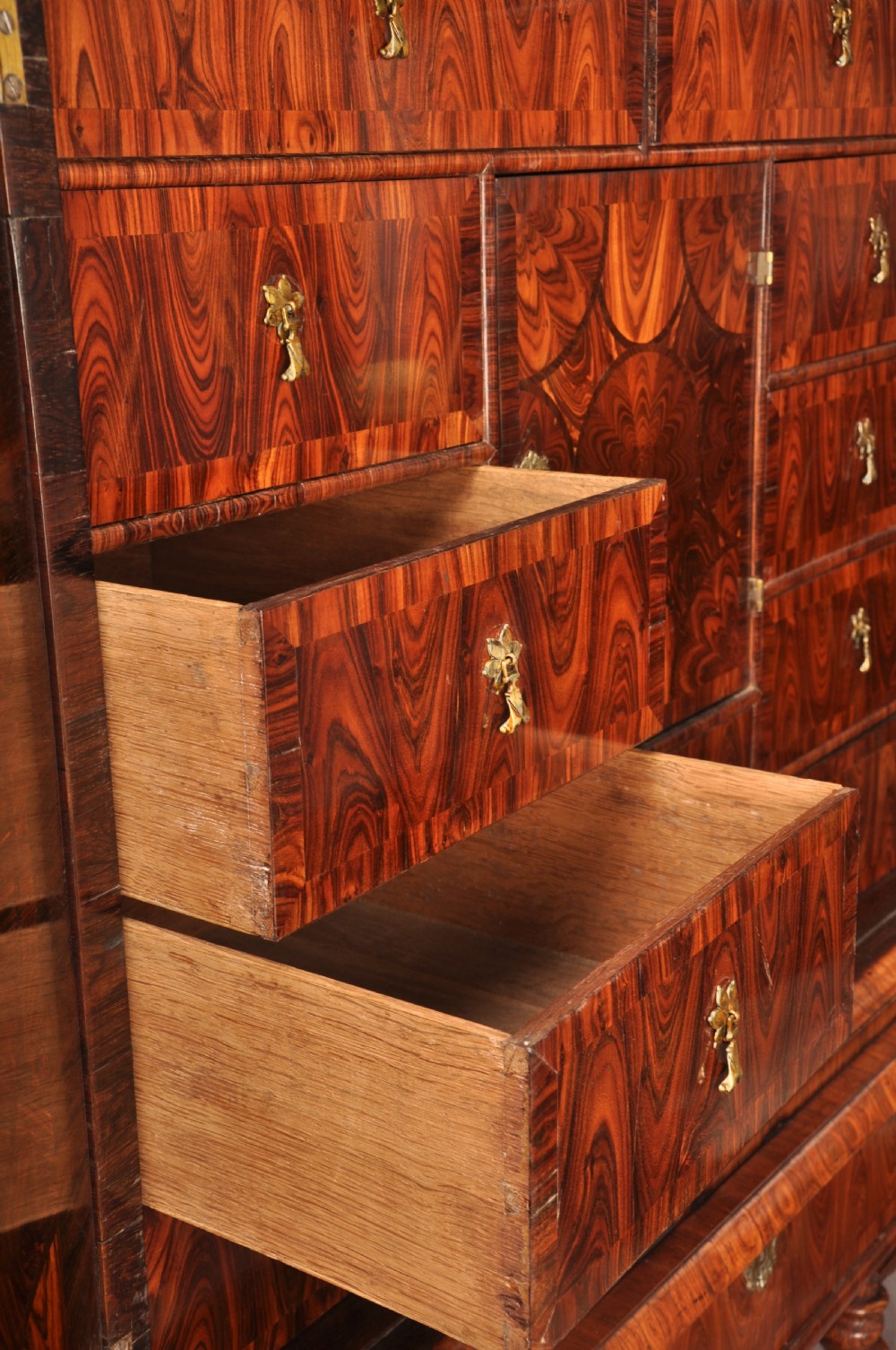 A seventeenth-century kingwood cabinet on stand featuring geometric oyster parquetry doors, a single frieze drawer, six barley twist legs, and a shaped stretcher. View XIV