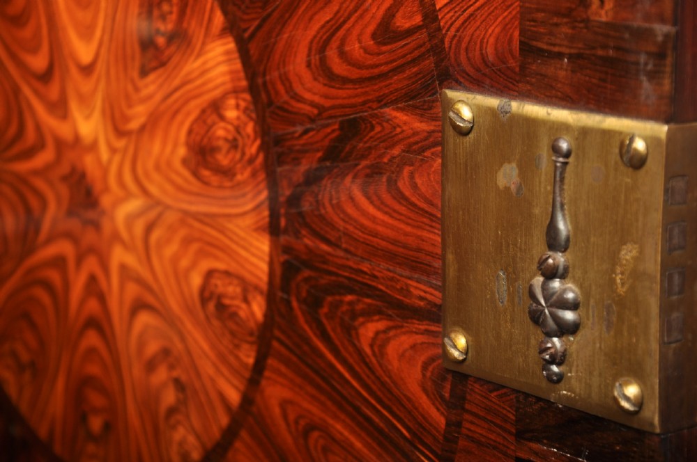 A seventeenth-century kingwood cabinet on stand featuring geometric oyster parquetry doors, a single frieze drawer, six barley twist legs, and a shaped stretcher. View XVI