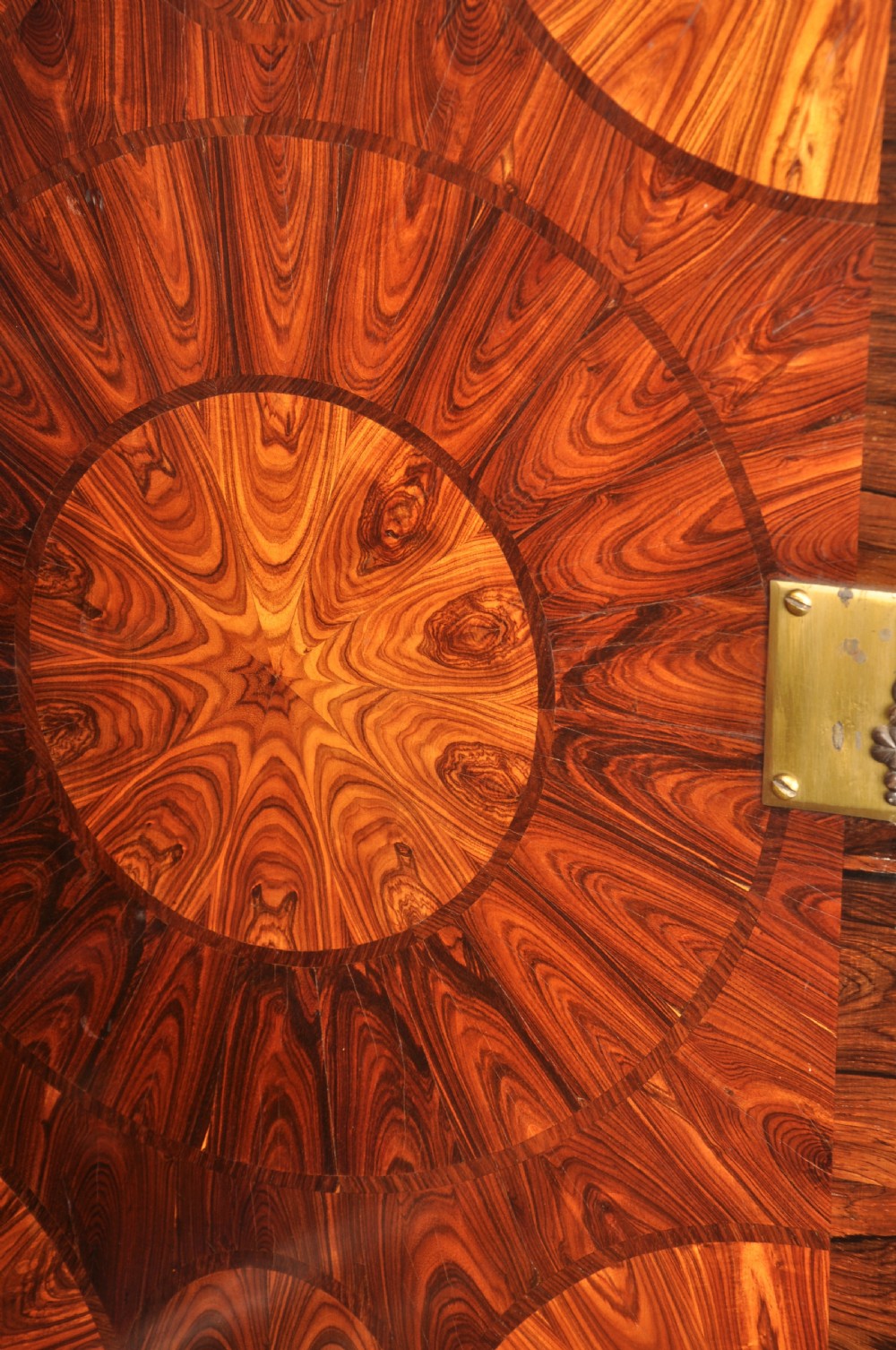 A seventeenth-century kingwood cabinet on stand featuring geometric oyster parquetry doors, a single frieze drawer, six barley twist legs, and a shaped stretcher. View XVIII