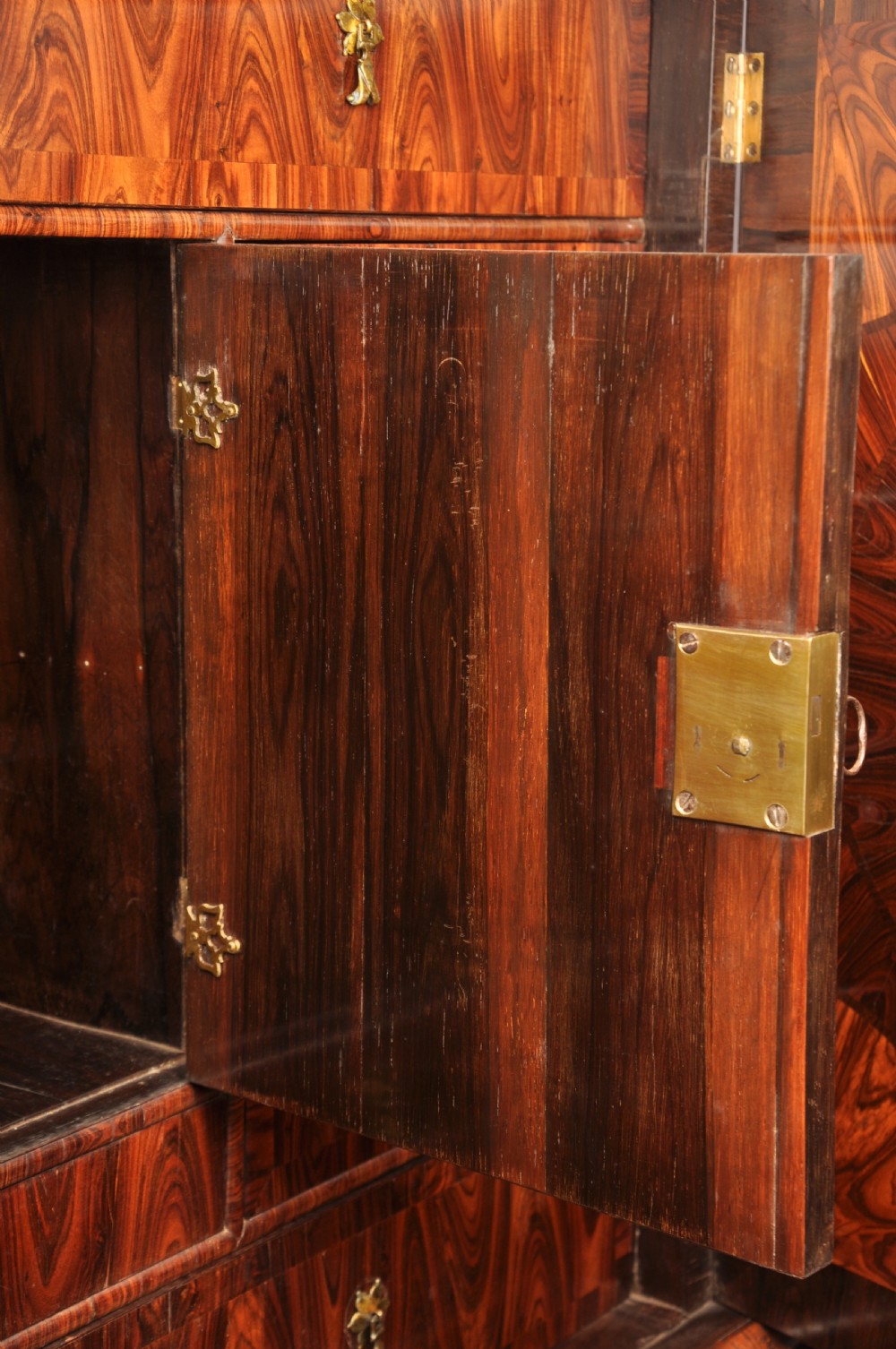 A seventeenth-century kingwood cabinet on stand featuring geometric oyster parquetry doors, a single frieze drawer, six barley twist legs, and a shaped stretcher. View XX