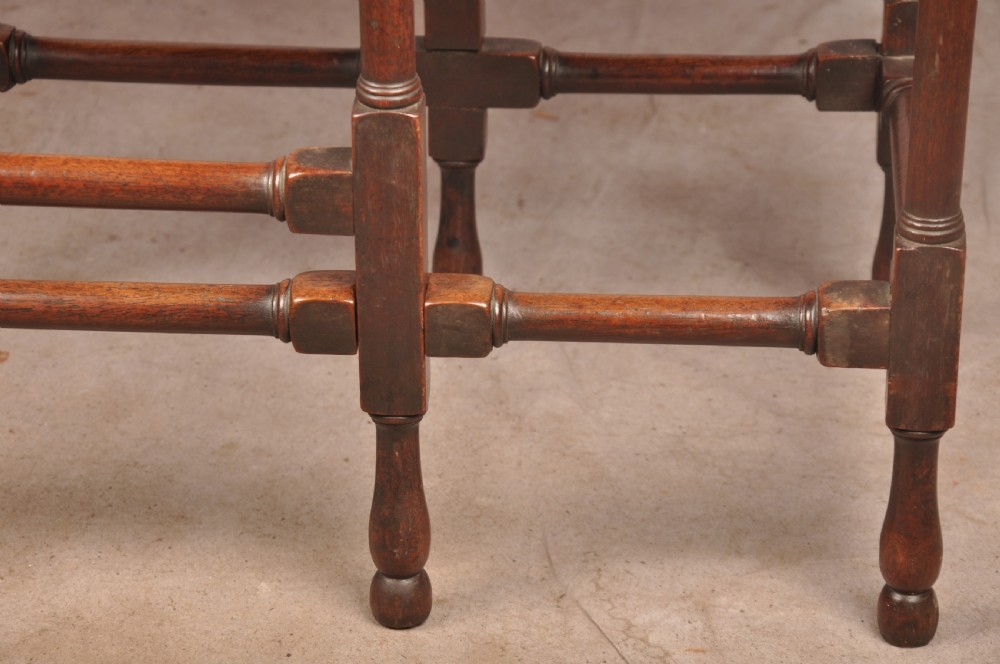 An 18th-century mahogany drop-leaf spider table featuring slender turned legs, cross stretchers, and two fold-out side flaps. View VII