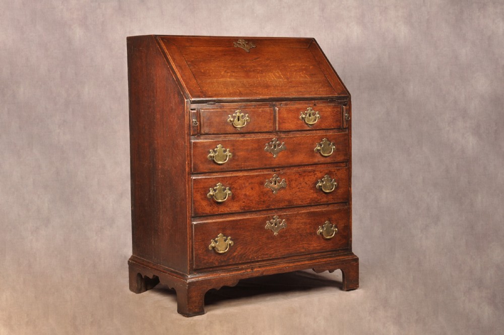 A Fine Early 18th Century Oak Bureau Of Small Proportions