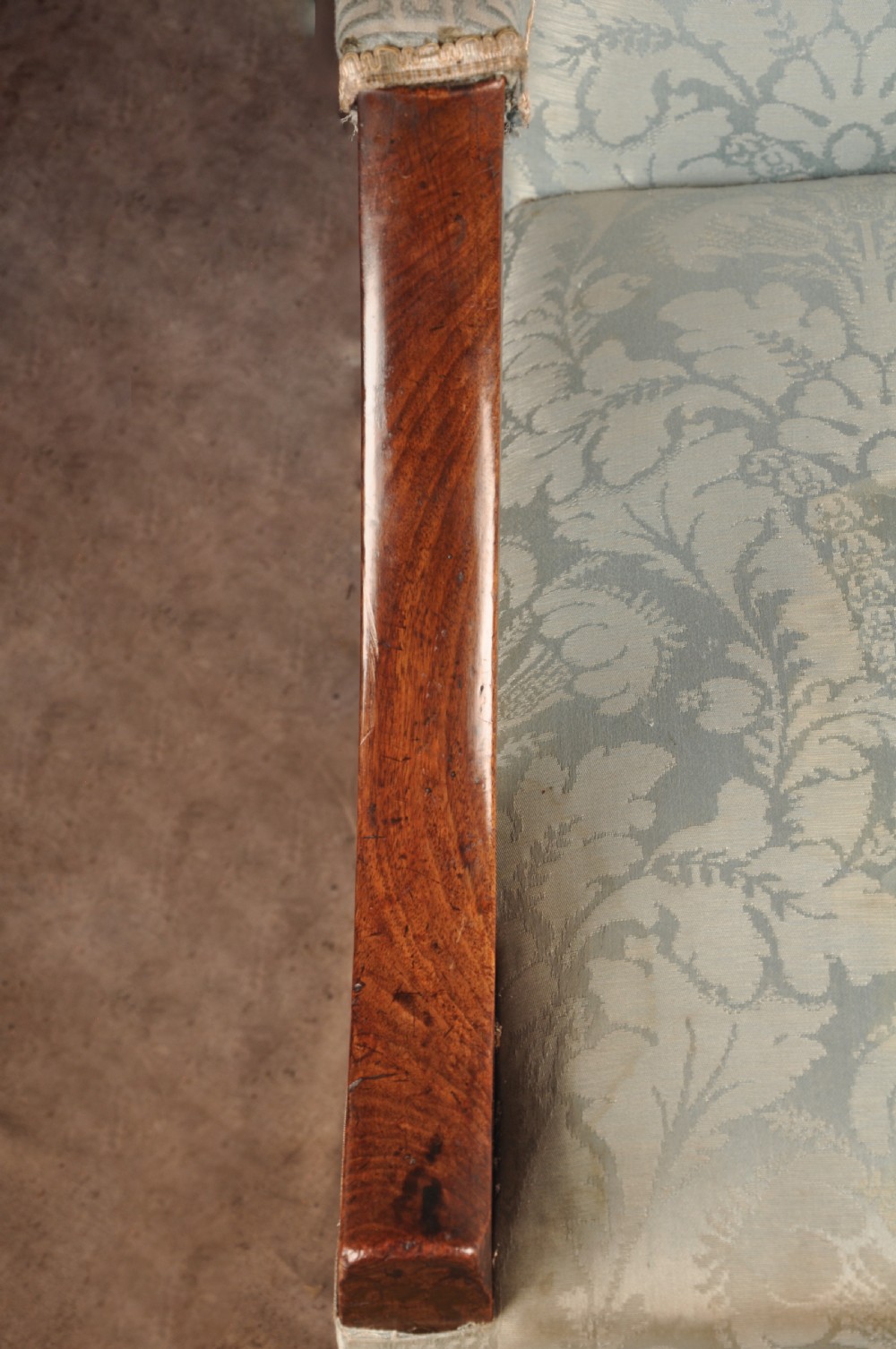 An eighteenth-century mahogany Gainsborough library armchair upholstered in pale blue damask fabric with brass castors. View V
