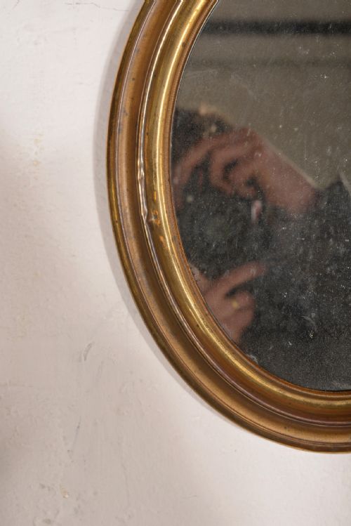 A VICTORIAN GILT BRASS OVAL WALL MIRROR WITH MERCURY PLATE C1900 - ADDITIONAL PHOTO 2