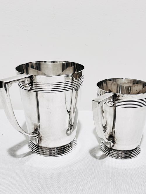 A HANDSOME PAIR OF TANKARDS DESIGNED BY KEITH MURRAY FOR MAPPIN WEBB C1930 - ADDITIONAL PHOTO 2