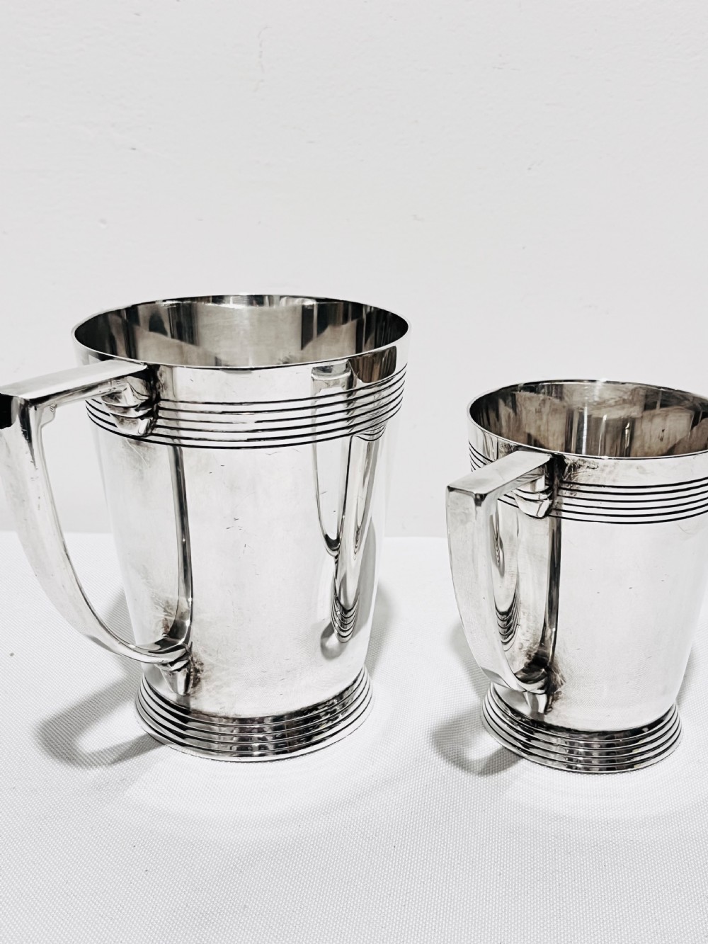 A handsome pair of tankards designed by Keith Murray for Mappin & Webb c1930 View III