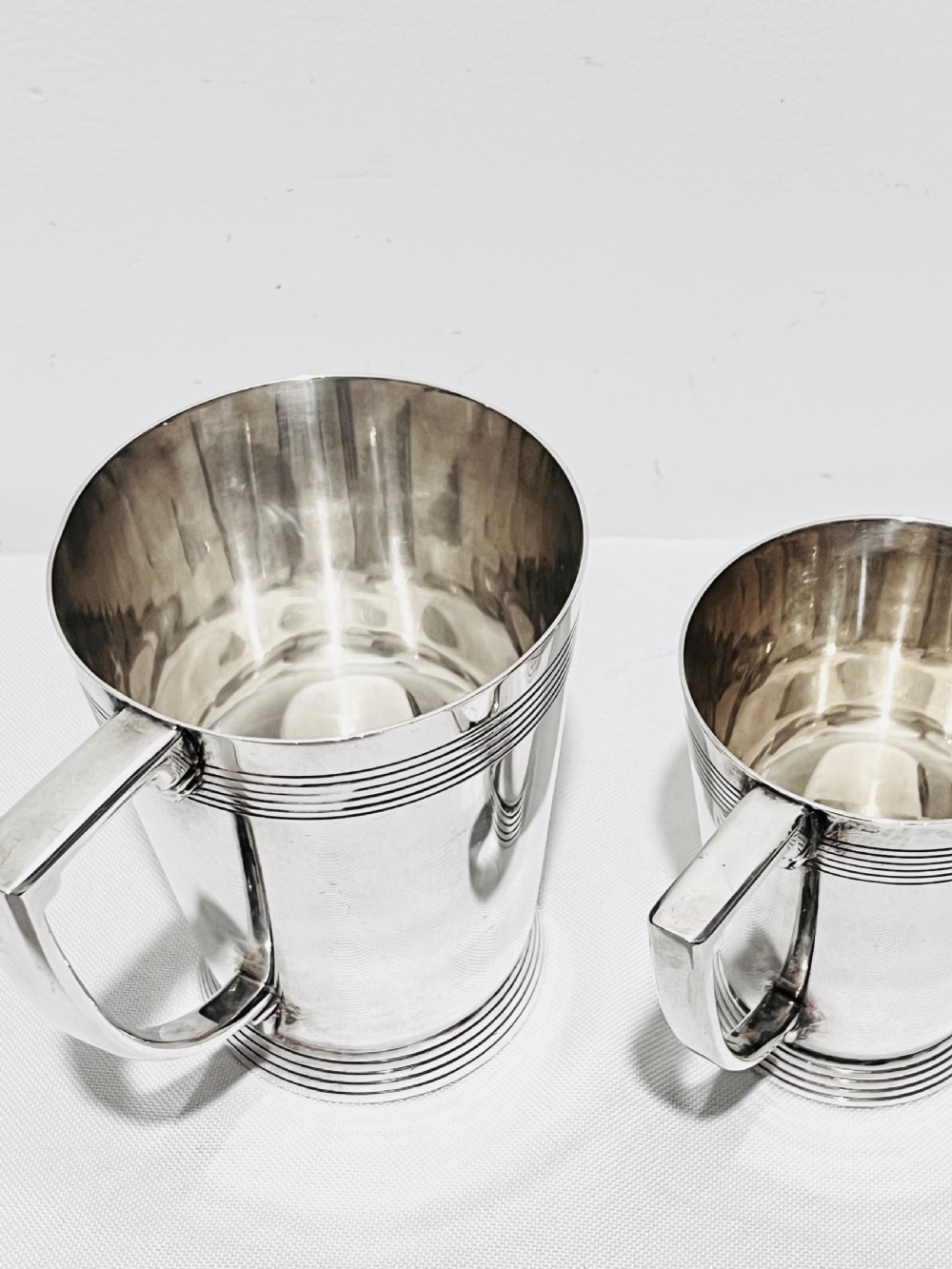 A handsome pair of tankards designed by Keith Murray for Mappin & Webb c1930 View IV