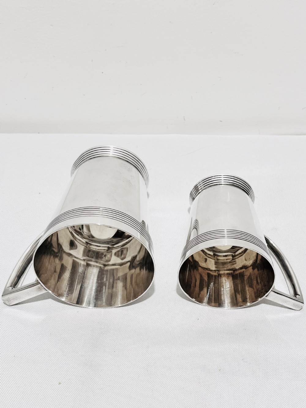 A handsome pair of tankards designed by Keith Murray for Mappin & Webb c1930 View VIII