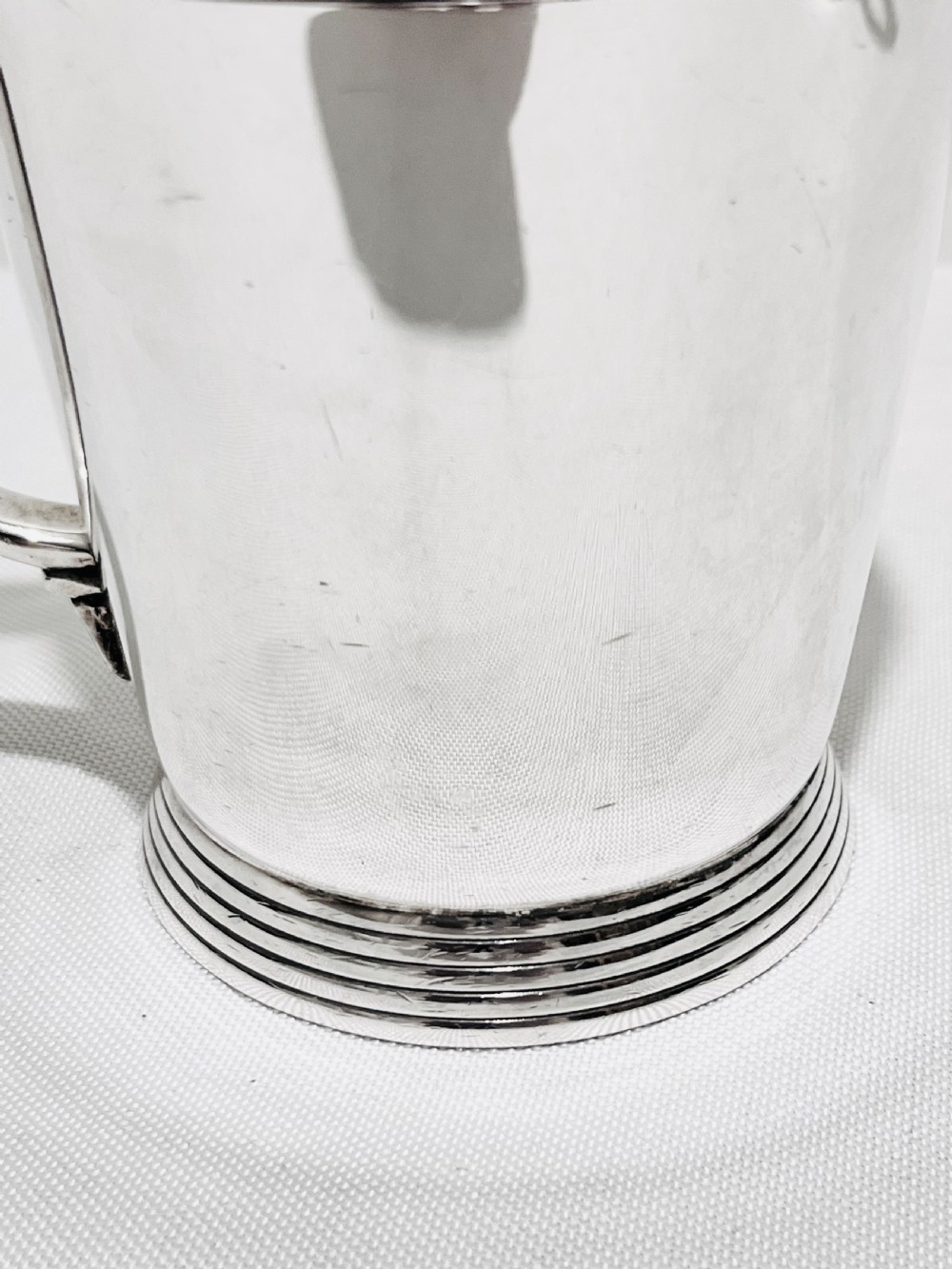 A handsome pair of tankards designed by Keith Murray for Mappin & Webb c1930 View X