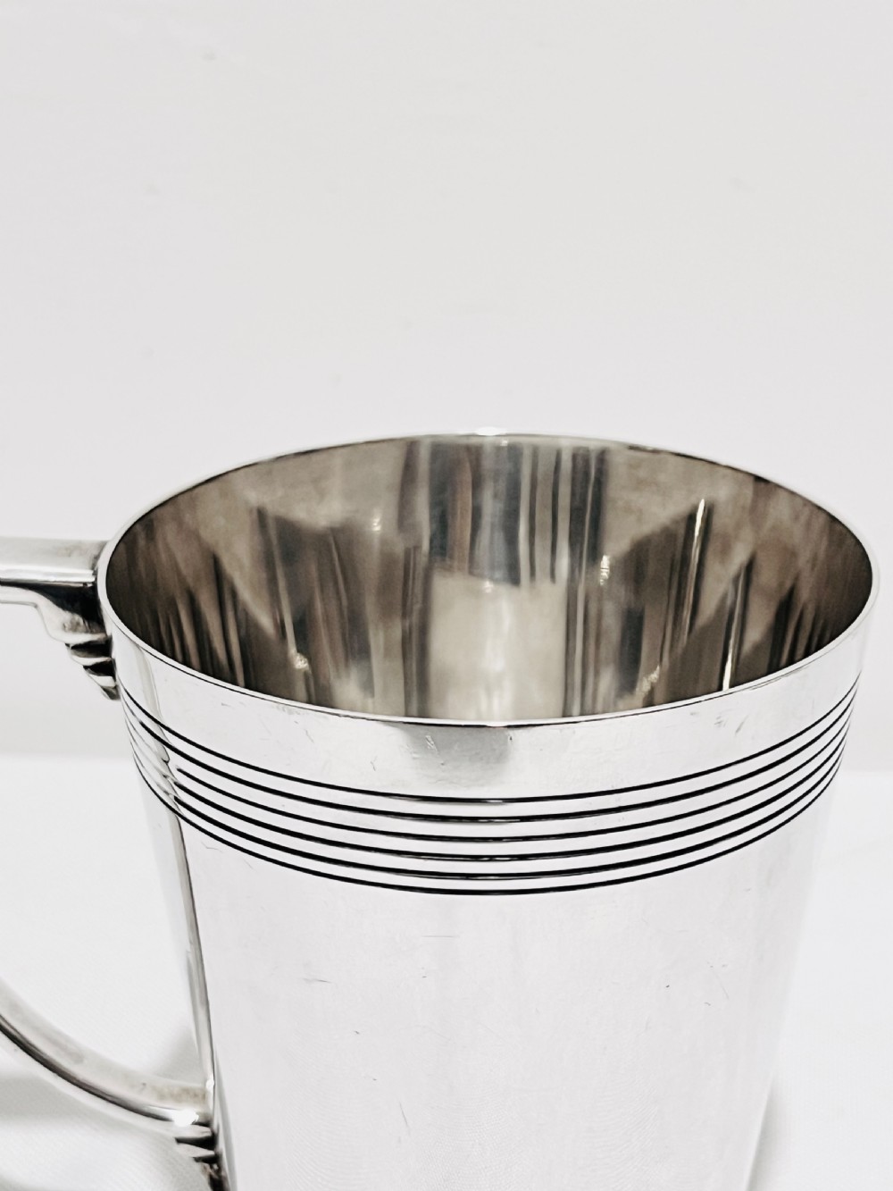 A handsome pair of tankards designed by Keith Murray for Mappin & Webb c1930 View XI