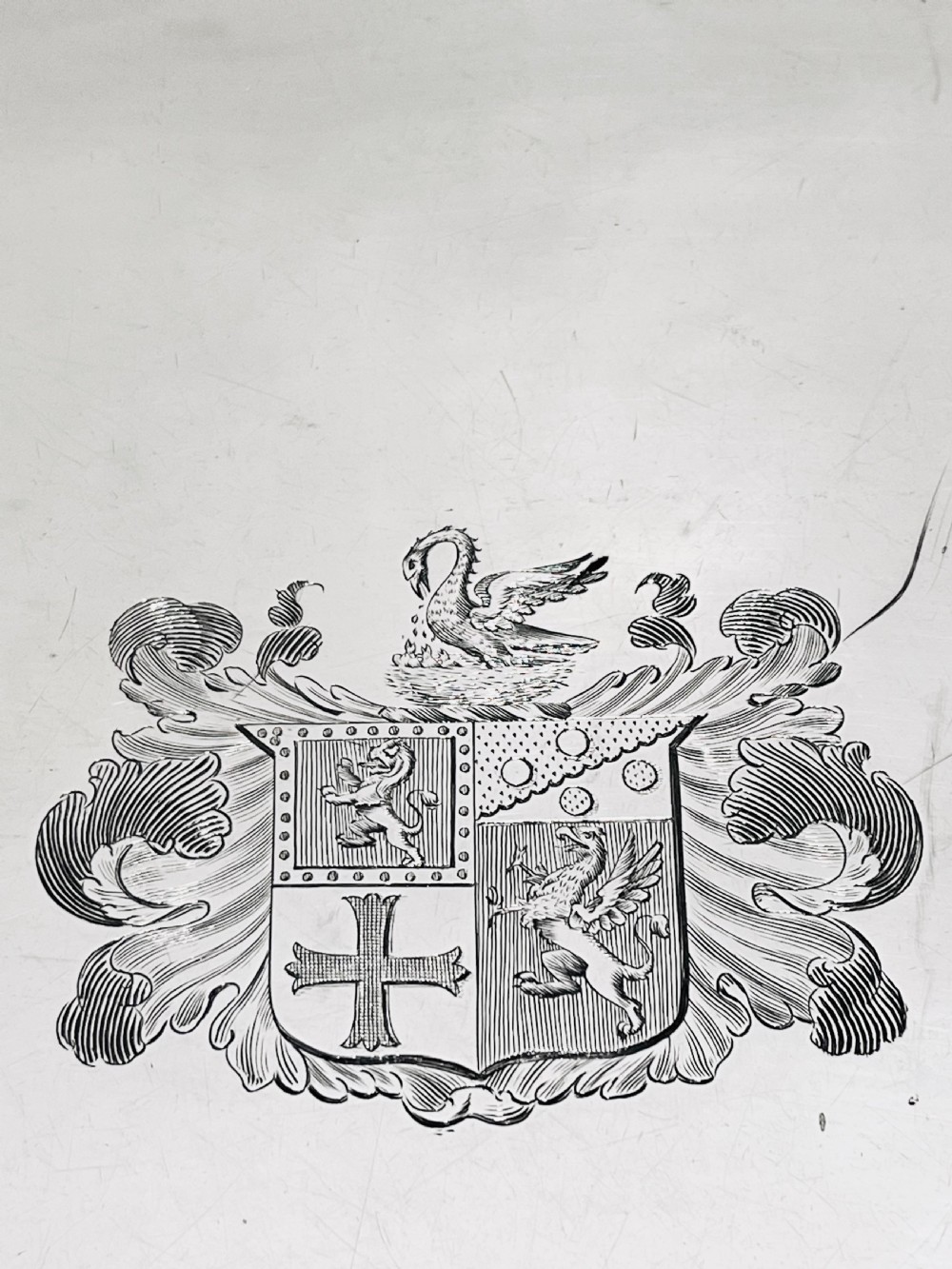 A rectangular silver-plated tray featuring ornate cast acanthus handles, a gadrooned rim, and an engraved heraldic coat of arms at the centre. View II